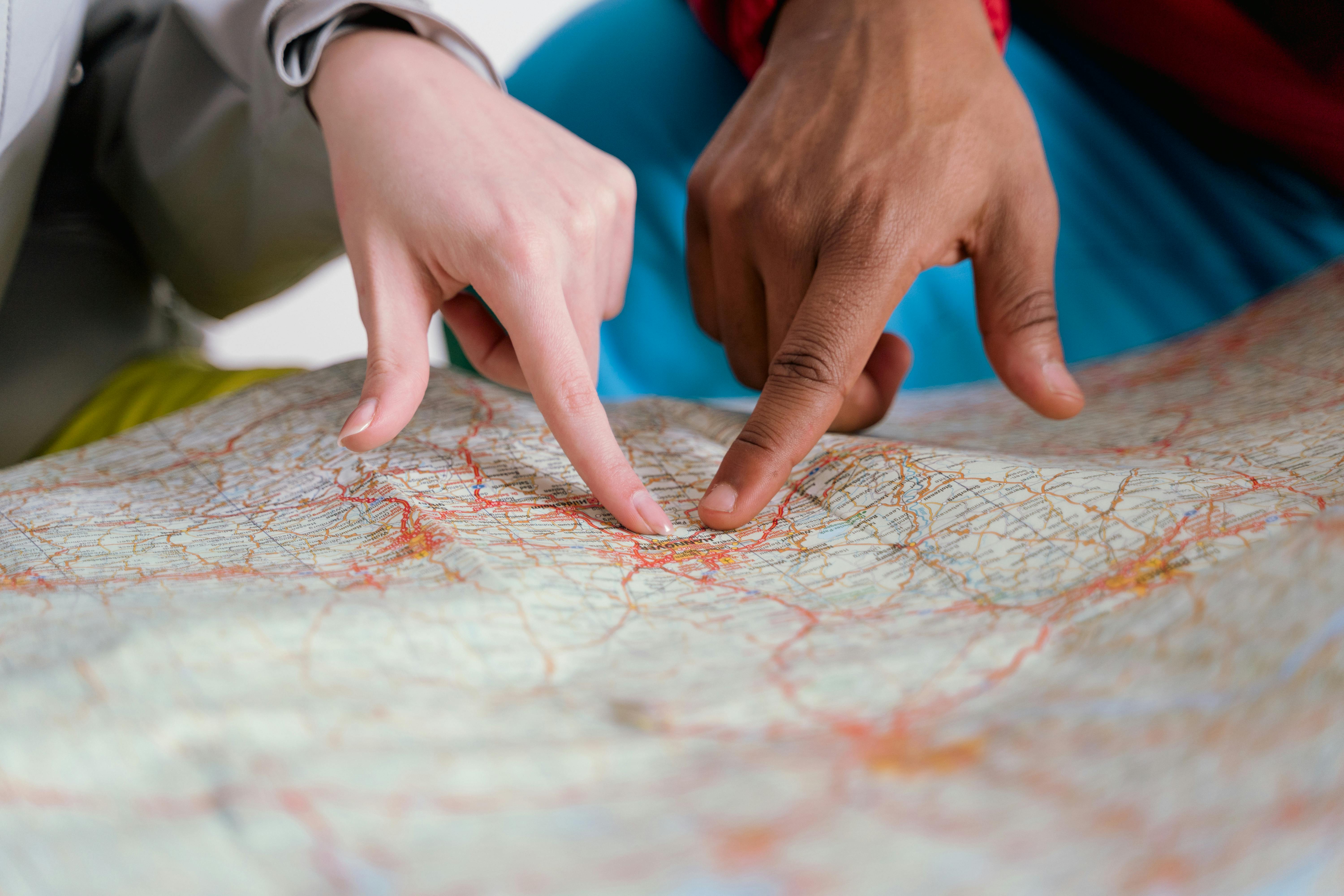 Photo by Tima Miroshnichenko: https://www.pexels.com/photo/people-pointing-finger-on-map-7009485/