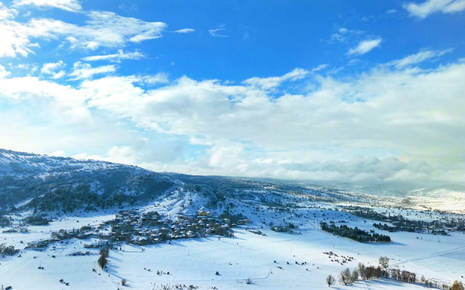 Snow on the hills above Yakaboy